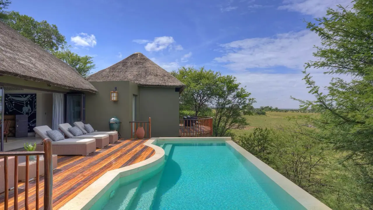 Private villa plunge pool and thatched roof overlooking the Serengeti plains at Four Seasons Safari Lodge Serengeti