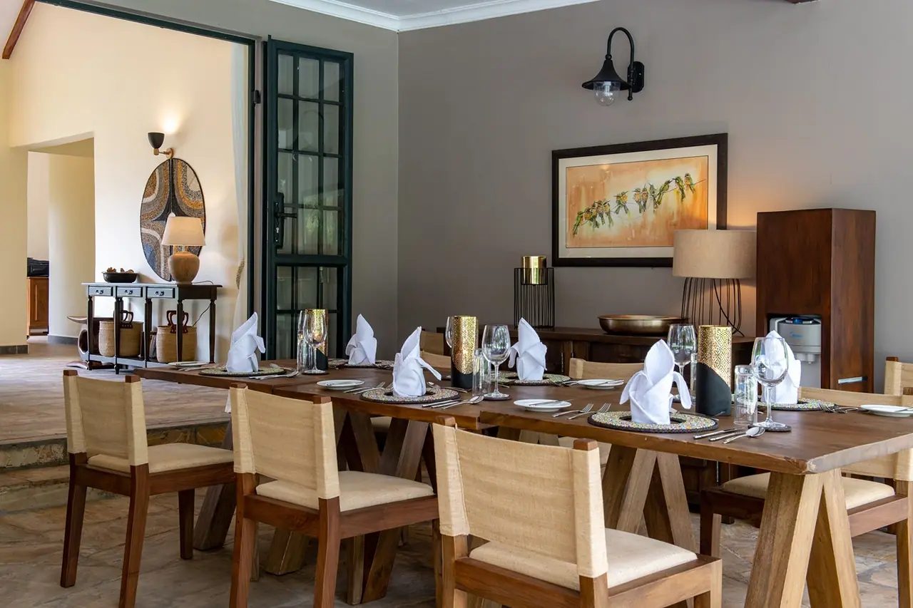 The dining table laid for dinner