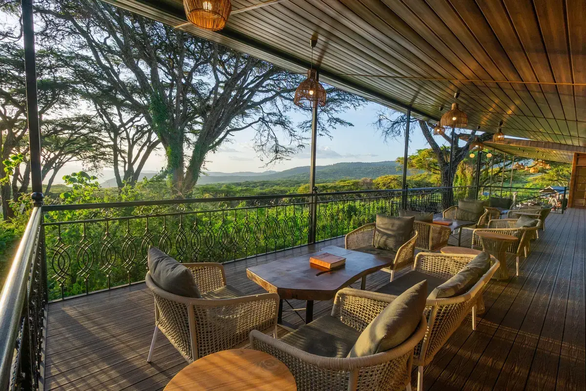 Covered lounge terrace at Ngorongoro Lion's Paw overlooking the forested highlands