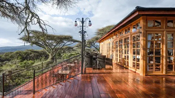 Polished wooden deck and lamp posts at Ngorongoro Lion's Paw overlooking the highlands