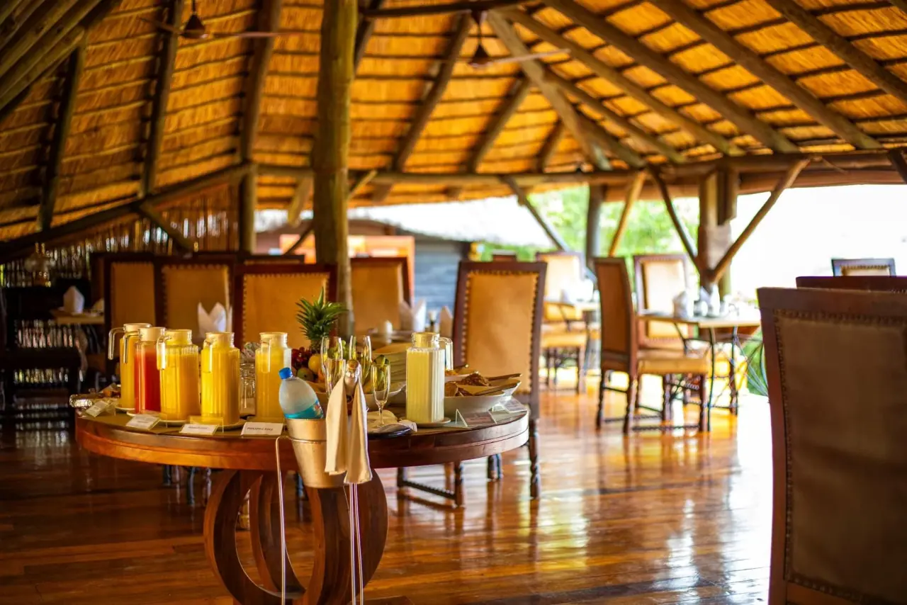 Breakfast buffet with juice jugs and fresh fruit set out at Serena Mivumo River Lodge