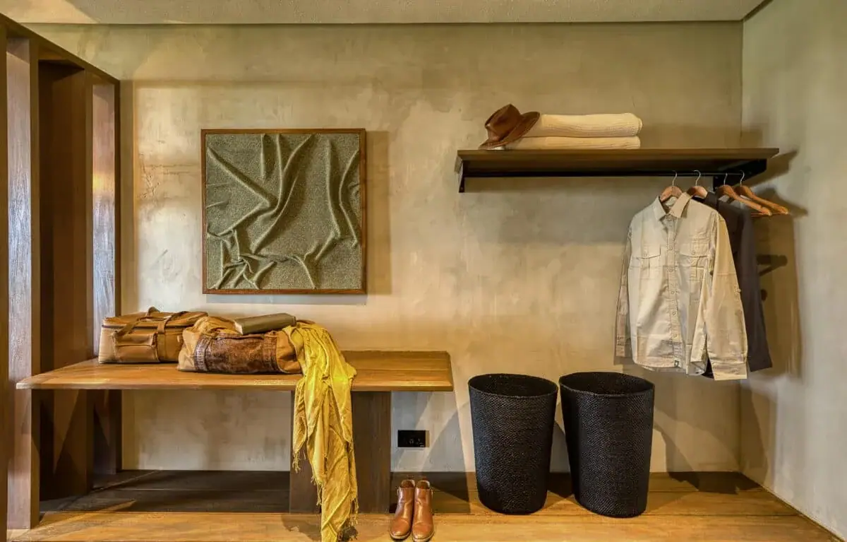 Dressing area with safari clothing, hats, and luggage at Serengeti Explorer