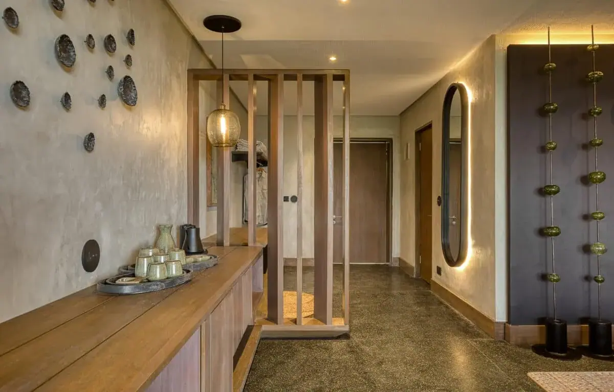 Interior hallway with stone-studded decor and a lit pendant lamp at Serengeti Explorer