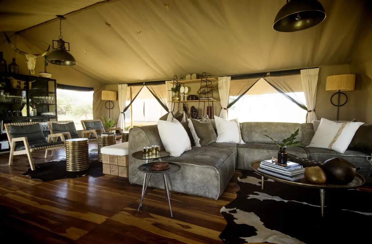Lounge tent bar area at Siringiti Serengeti Camp with a cowhide rug and animal-skull decor