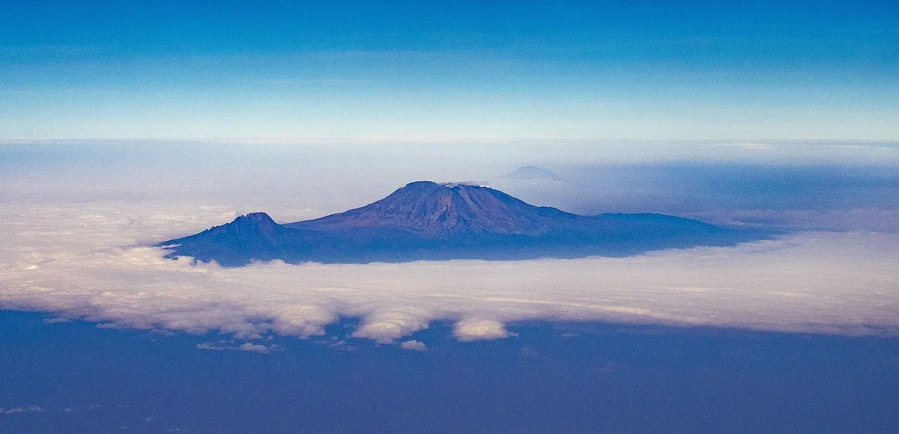 Aerial view of Kilimanjaro rising above a layer of cloud