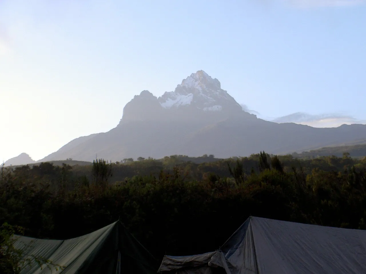 Mawenzi's jagged peak above the moorland and a camp