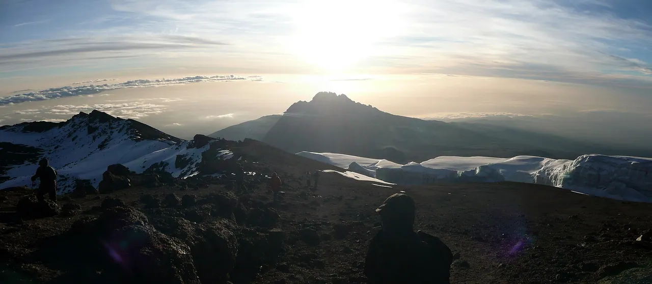 Mawenzi's rugged ridge catching the morning sun above cloud