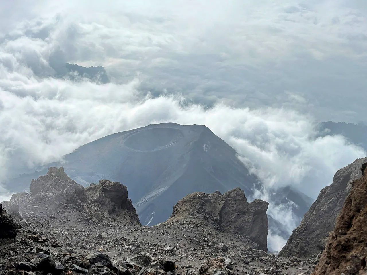 Cloud swirling inside the caldera of Mount Meru